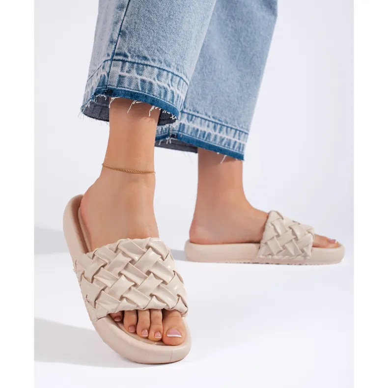 Beige braided women's slippers.