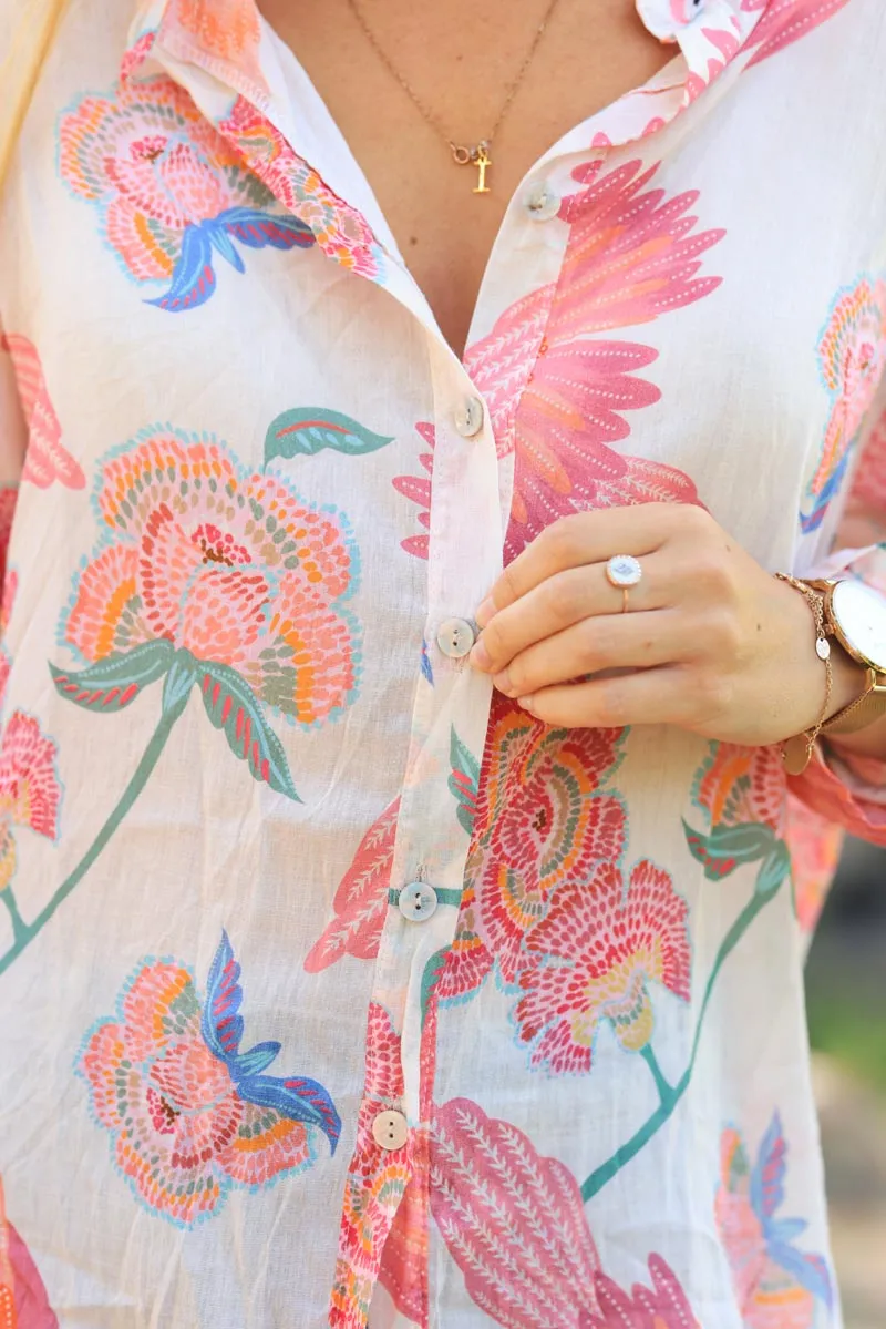 Light ecru cotton voile shirt with colorful flower and parrot motifs.