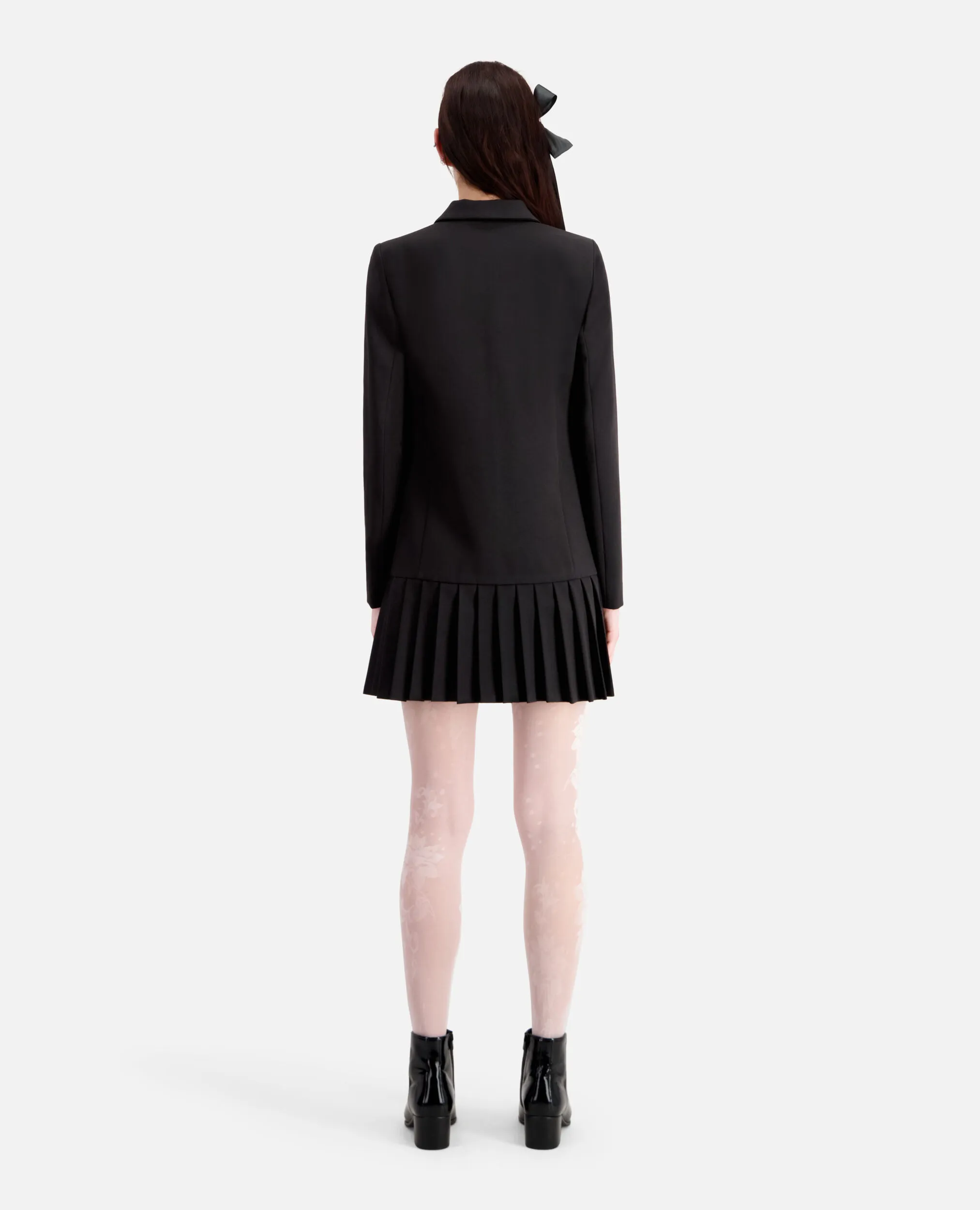 Short black suit dress.