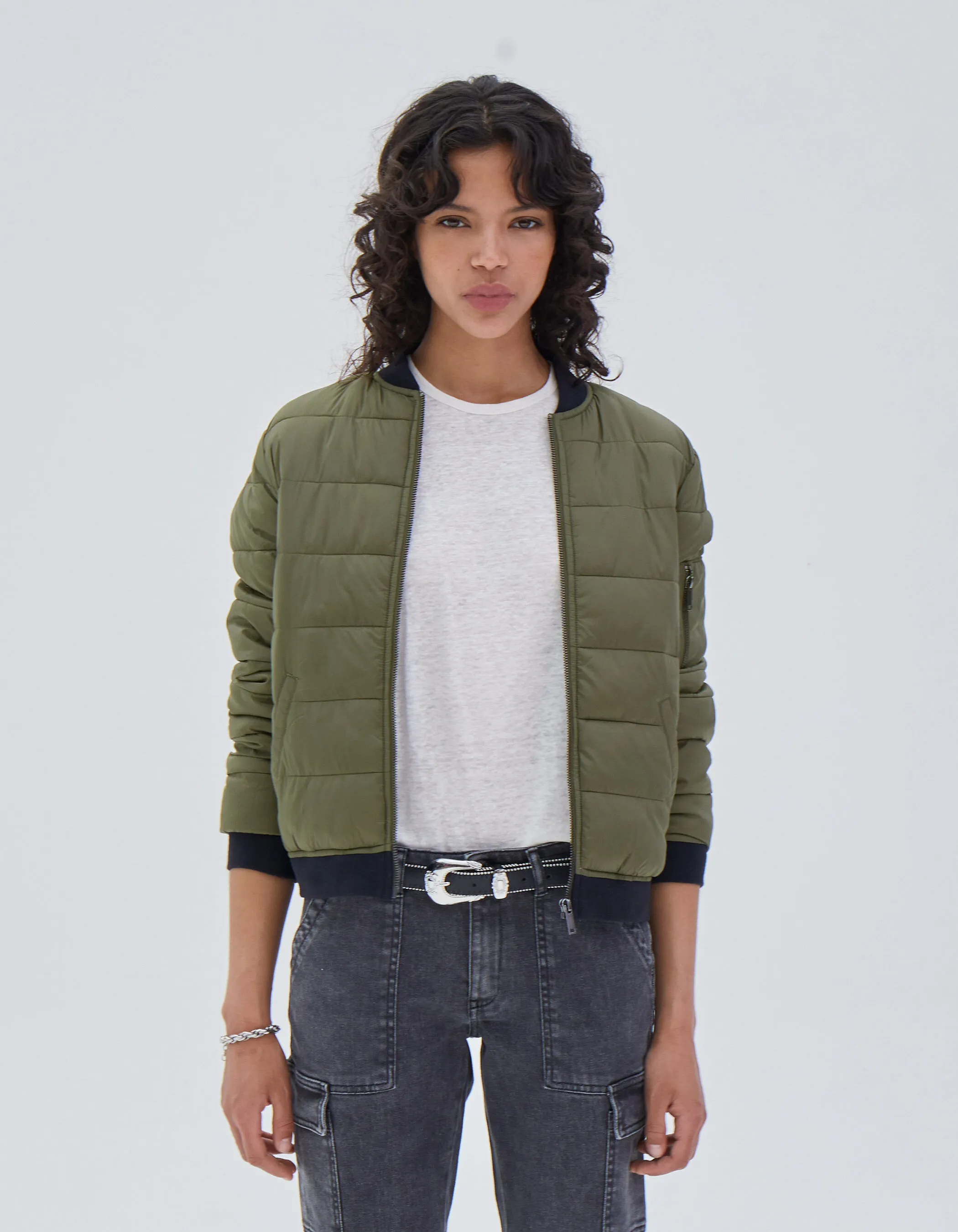 Short khaki women's jacket with high collar.